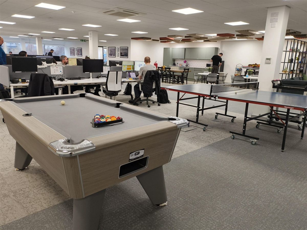 Open-plan office in Newcastle with UniFi Wi-Fi coverage across desks and breakout areas