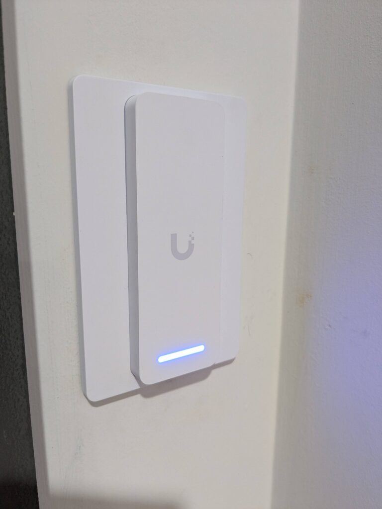 UniFi Access NFC door reader installed on an internal wall